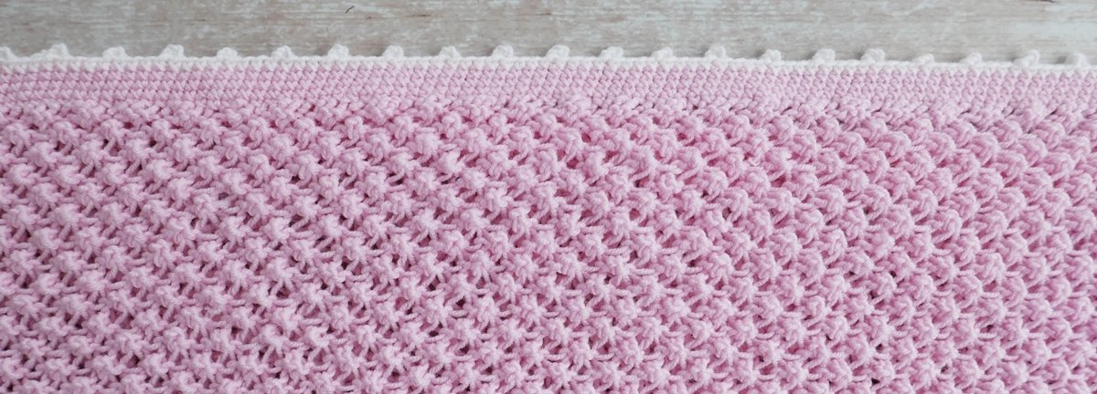 Blog-Inhaltsbild für 'Gratis Strickanleitung Decke im Röschenmuster'