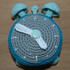 Crochet pattern for an alarm clock with moveable clock hands