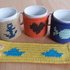 Häkelanleitung für Tassenwärmer "Cup cozy" mit 4 eingehäkelten Motiven