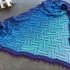 Step by step crochet instructions for a shawl with a sophisticated pattern