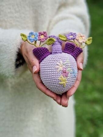 Crochet forget - me - not flowers bouquet in anatomical heart vase
